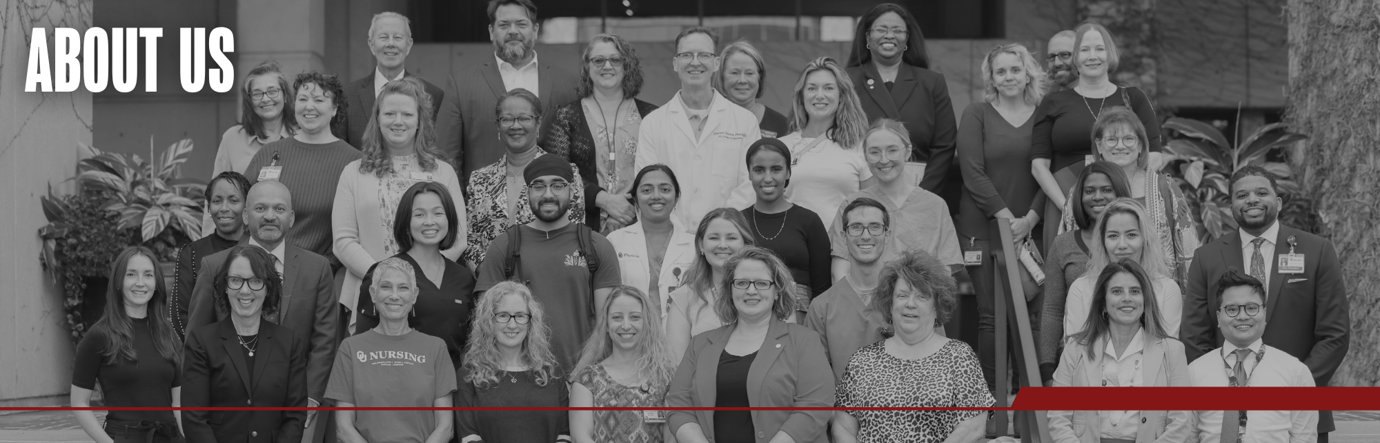 Black and white image of faculty, staff, and students posing on the stairs outside of the Bird Library. Title on image says "About Us".