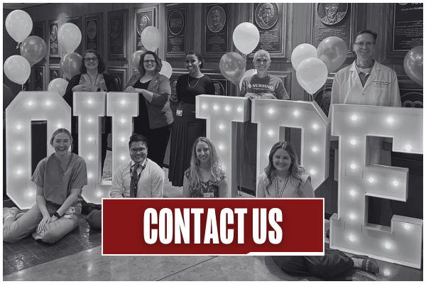 Black and white image of students, faculty, and staff posing with large light up letters that say "OU IPE". Title on image says "Contact Us".