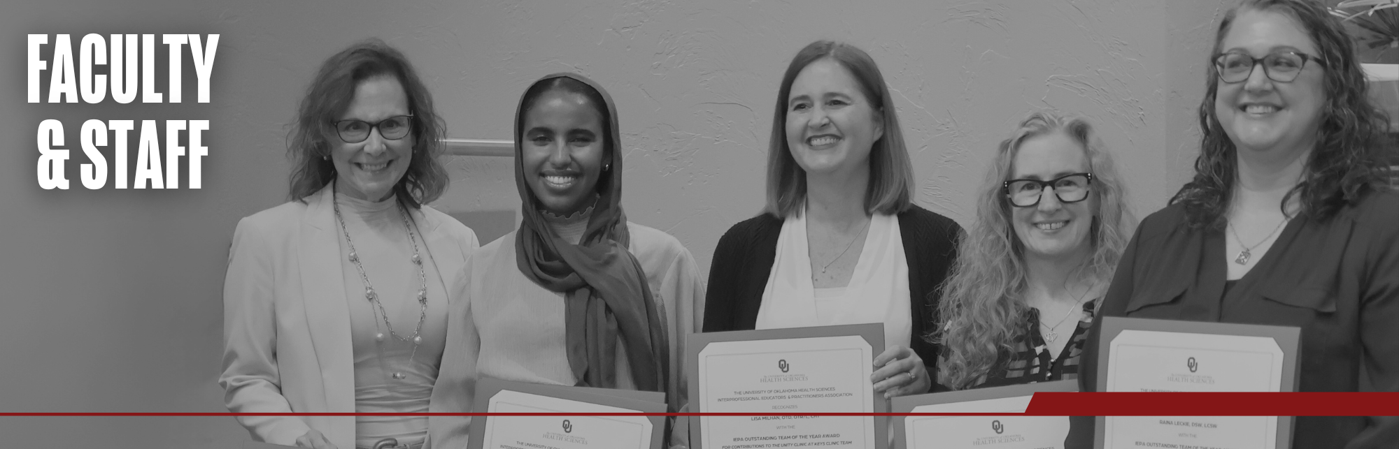 Black and white image of five faculty, and staff members smiling together as the hold IEPA Team of the Year Award certificates. Title on image says "Faculty & Staff".