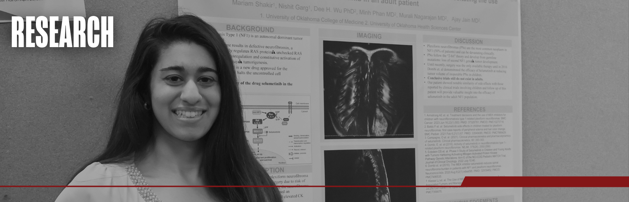 Black and white image of a student smiling in front of their research poster at the Unity Week student-led poster hall. Title on image says "Research".