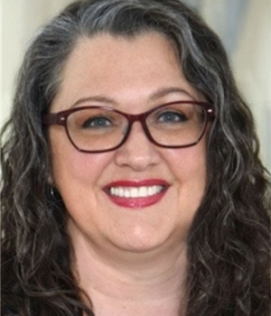 Photo of woman in hallway smiling